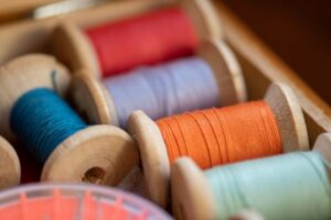 Photo by Bozhin Karaivanov red blue and white thread spool
