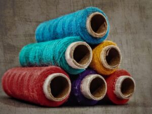 Photo by :) :) blue red and yellow thread rolls