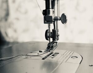 Photo by Every Angle gray scale photo of sewing machine